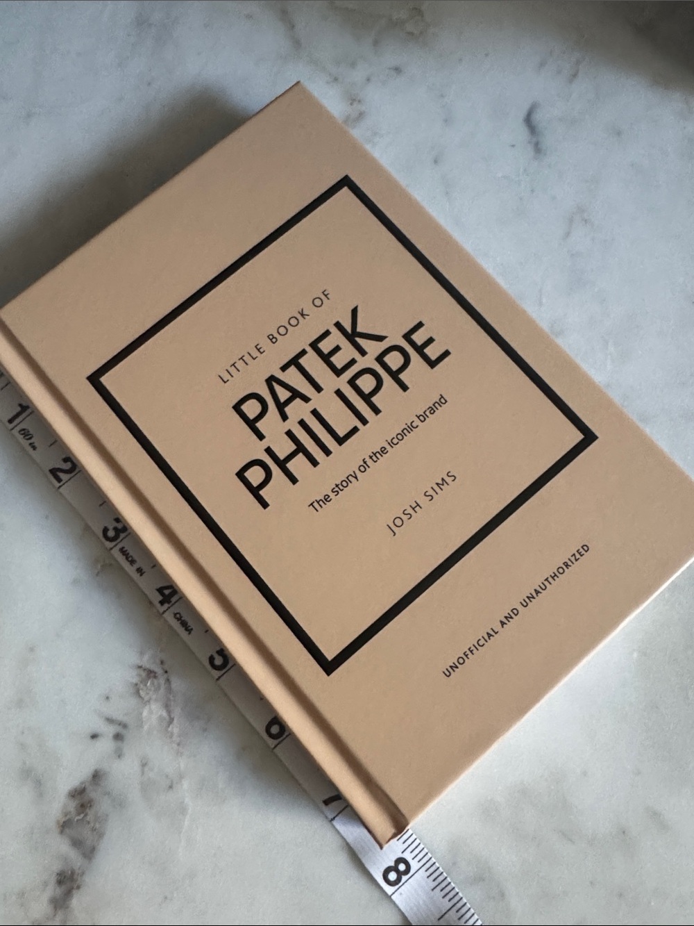Patek Philippe Beige Hardcover Book with Black Accents